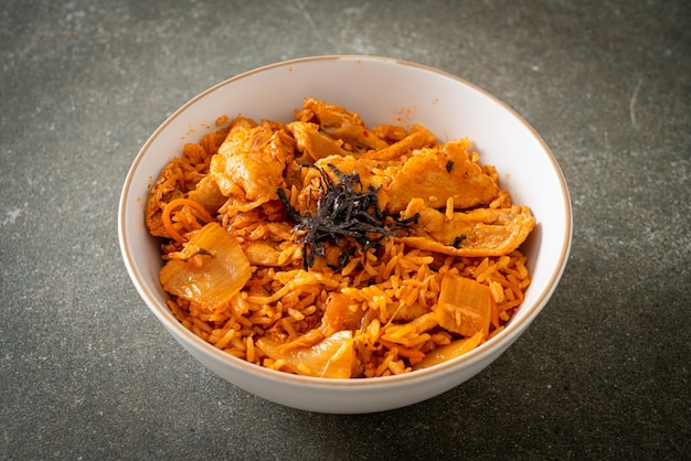 kimchi fried rice with pork sliced - Korean food style