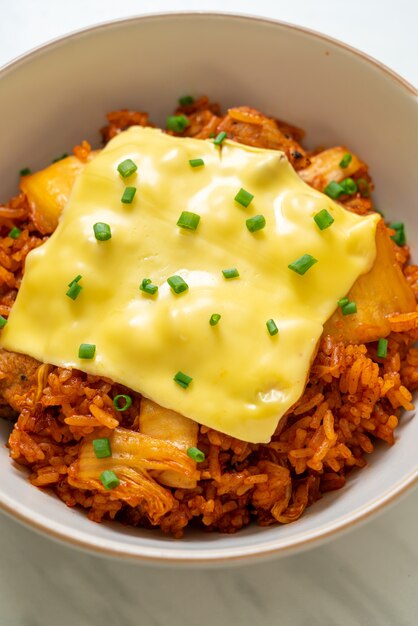 kimchi fried rice with pork and topped cheese - Asian and fusion food style