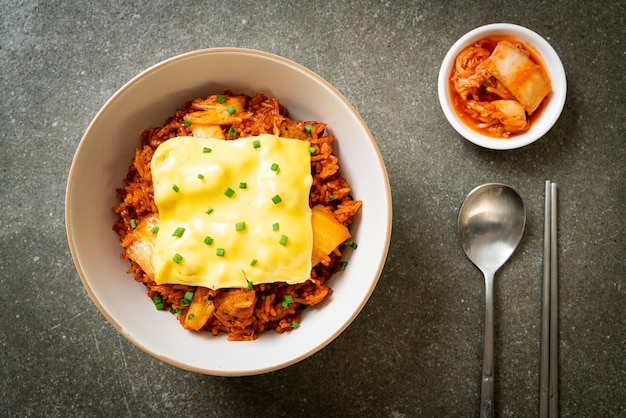 kimchi fried rice with pork and topped cheese. Asian and fusion food style