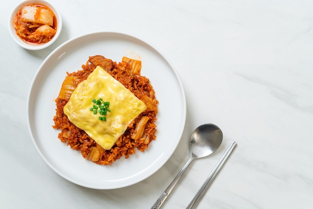 kimchi fried rice with pork and topped cheese - Asian and fusion food style