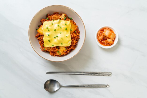 kimchi fried rice with pork and topped cheese - Asian and fusion food style