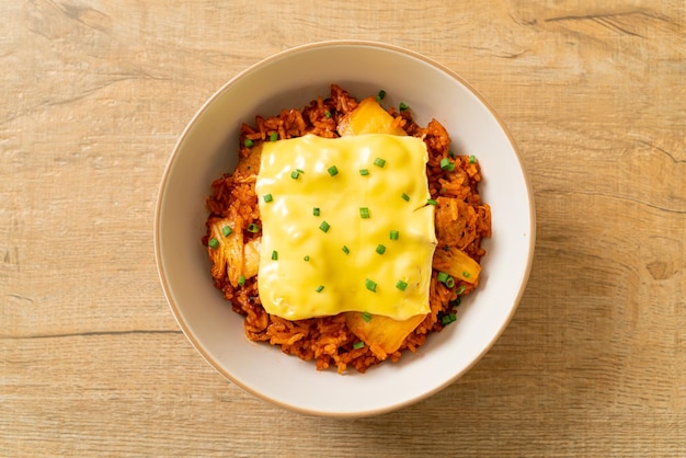 kimchi fried rice with pork and topped cheese - asian and fusion food style