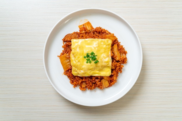 kimchi fried rice with pork and topped cheese - Asian and fusion food style