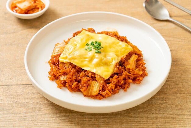 Kimchi fried rice with pork and topped cheese