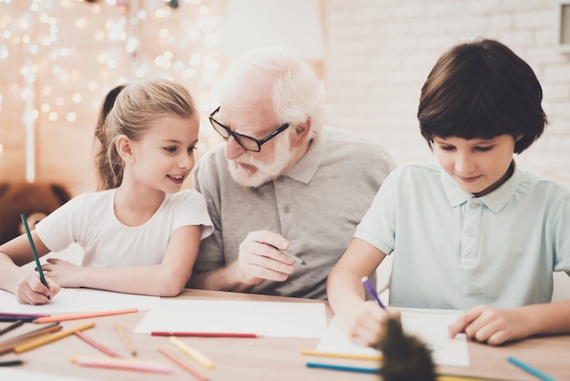 Kind Elderly Grandpa Spends Weekend with Children.