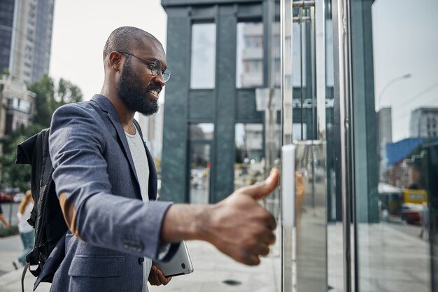 Kind man expressing positivity while beginning his working day with walk