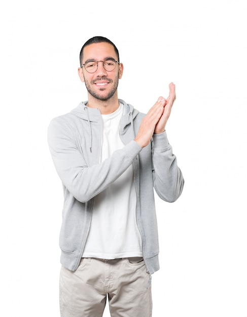 Kind young man applauding gesture