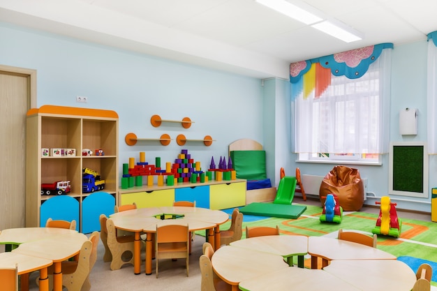 Kindergarten, modern interior of the room for classes and games.