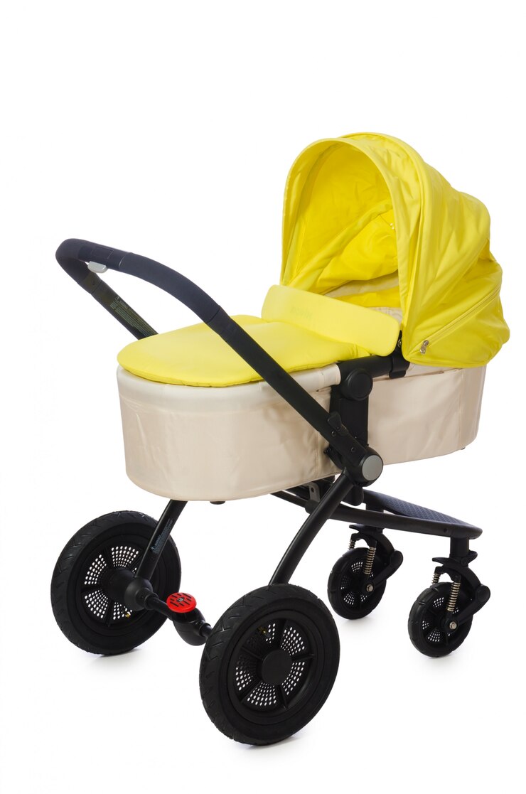 Foto kinderwagen op de witte achtergrond wordt geïsoleerd die