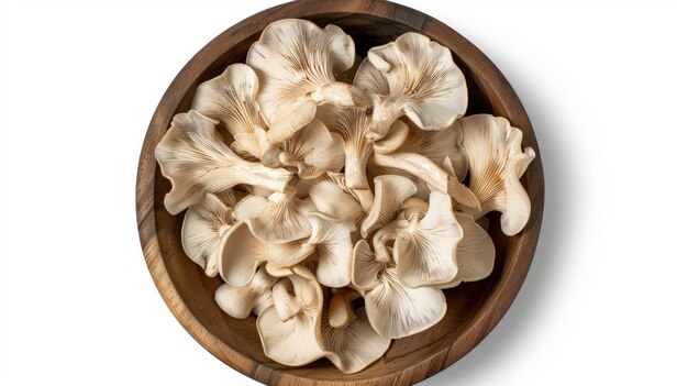 Photo king oyster mushroom or eringi in wooden bowl isolated on white background with clipping path