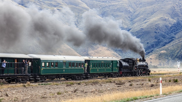 KINGSTON, NEAR LAKE WAKATIPU, NEW ZEALAND - FEBRUARY 17 : View of the Kingston Flyer steam train in Kingston  New Zealand on February 17, 2012. Unidentified people