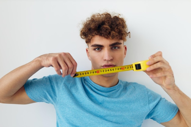 Kinky guy blue tshirt measuring tape posing Lifestyle unaltered