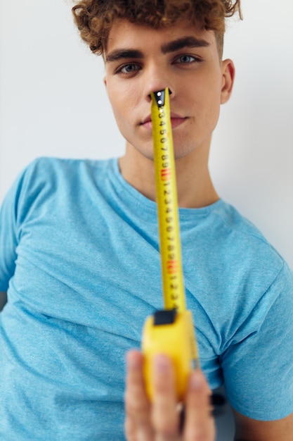 Kinky guy blue tshirt measuring tape posing Lifestyle unaltered