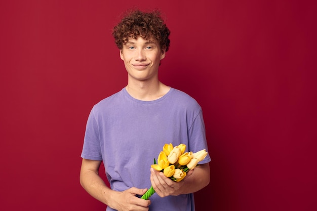 Kinky guy holding a yellow bouquet of flowers purple tshirts lifestyle unaltered