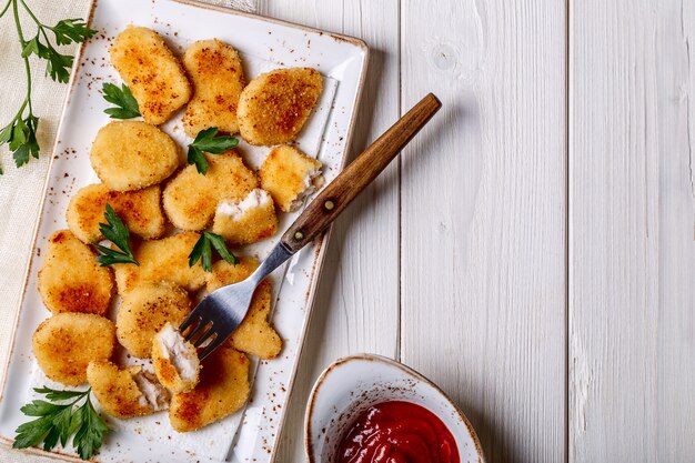 Kipnuggets met ketchup