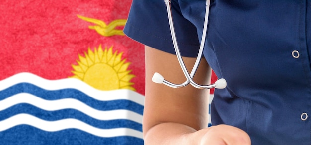 Kiribati flag female doctor with stethoscope, national healthcare system