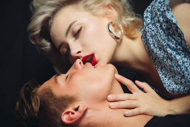 Kissing couple passion and sensual touch kissing posing indoor on dark background beautiful passiona