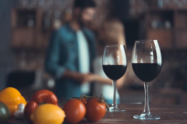 Kitchen background with wine and two glasses