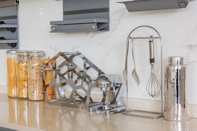 Kitchen bench shelves with various food ingredients on white background