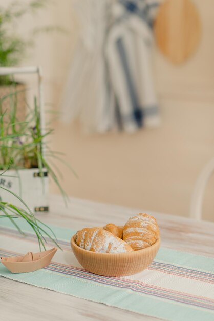 kitchen in bright colors, breakfast on a table in the kitchen