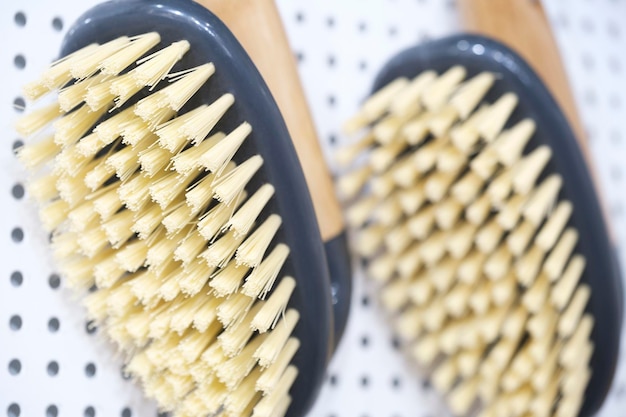 kitchen brushes hang in supermarket