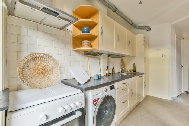 Kitchen in classic white with all the necessary equipment for\
use