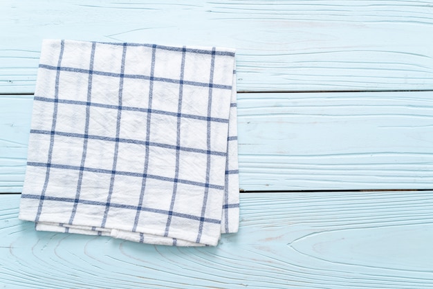 kitchen cloth (napkin) on blue wooden background