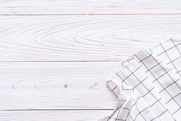 kitchen cloth (napkin) on wood background