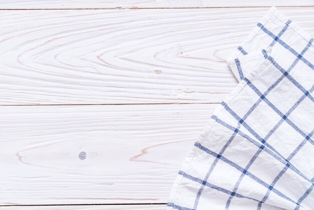 kitchen cloth (napkin) on wood background