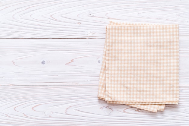 kitchen cloth (napkin) on wood background