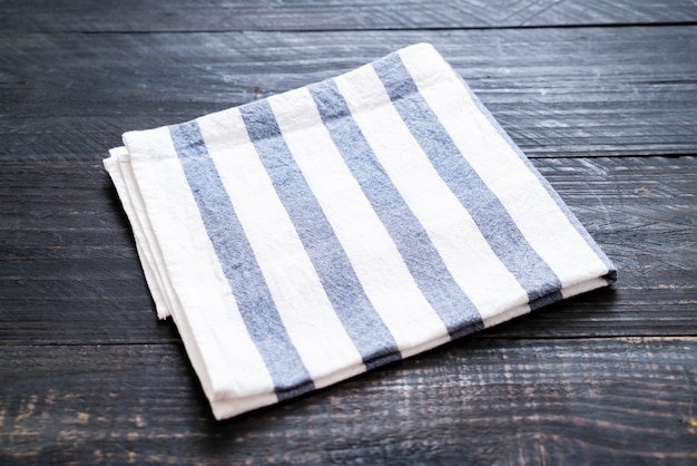 kitchen cloth (napkin) on wood background