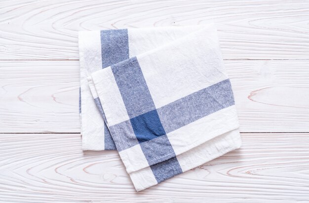 kitchen cloth (napkin) on wood background