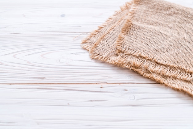 Photo kitchen cloth (napkin) on wood background