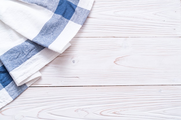 Photo kitchen cloth (napkin) on wood background