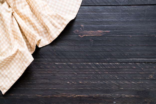 kitchen cloth (napkin) on wood background