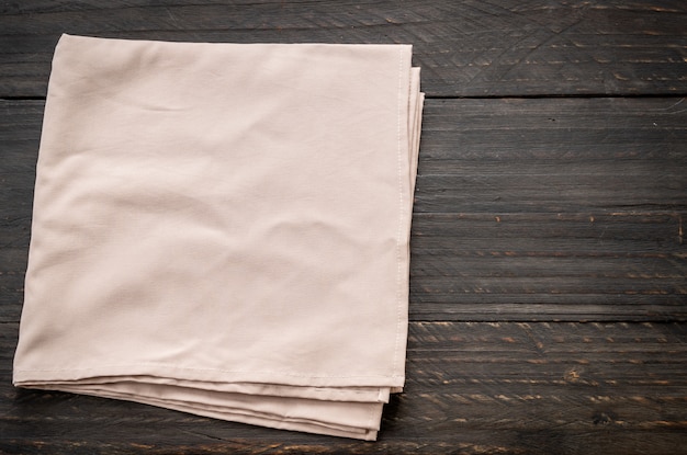 kitchen cloth (napkin) on wood background