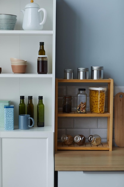 Kitchen cupboard with containers on shelves