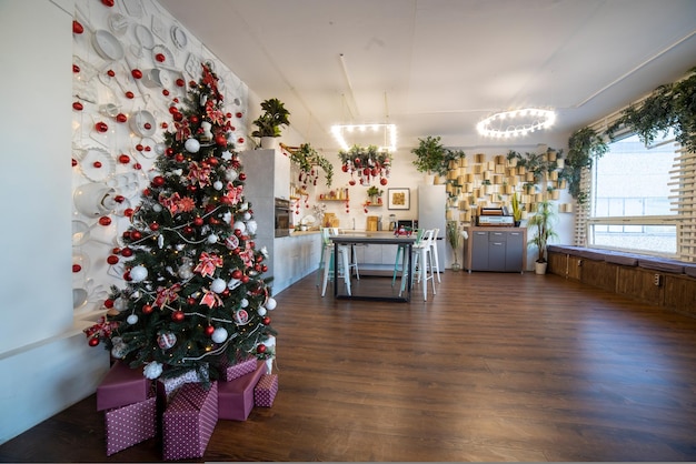 Kitchen decorated with pine garlands and christmas toys no people