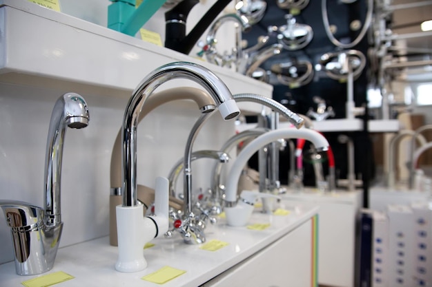 Kitchen faucets on shelf closeup plumbing shop