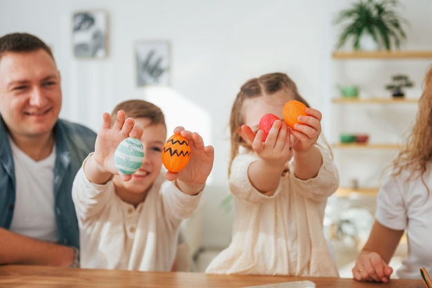 On the kitchen Happy family celebrating Easter holidays together