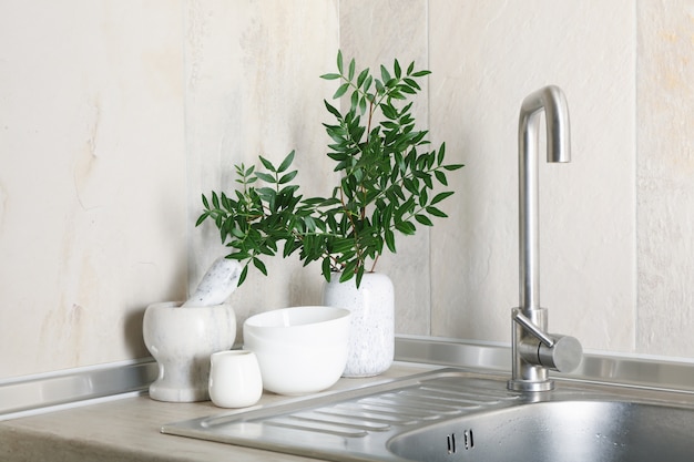 Kitchen interior with sink and different supplies