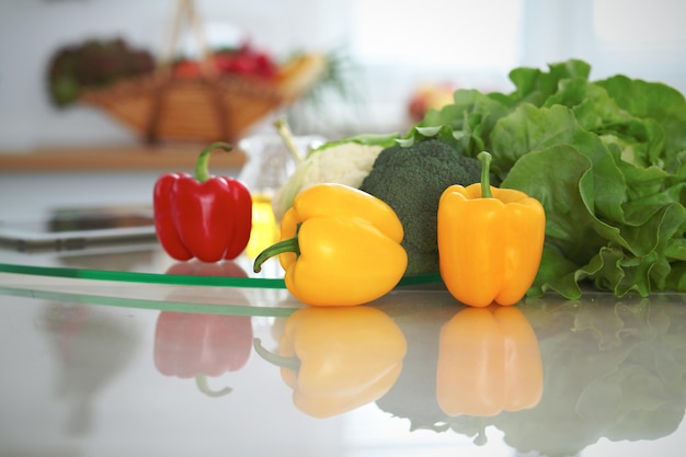 Kitchen interiors Many vegetables and other meal at glass table are ready for been cooked soon