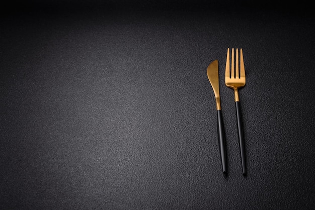 Kitchen knife and fork made of steel with copy space