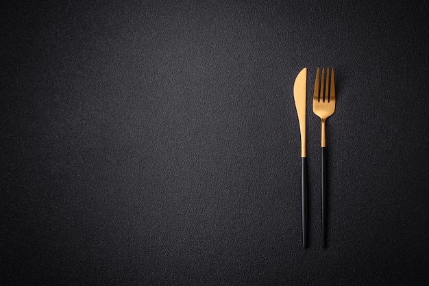 Kitchen knife and fork made of steel with copy space