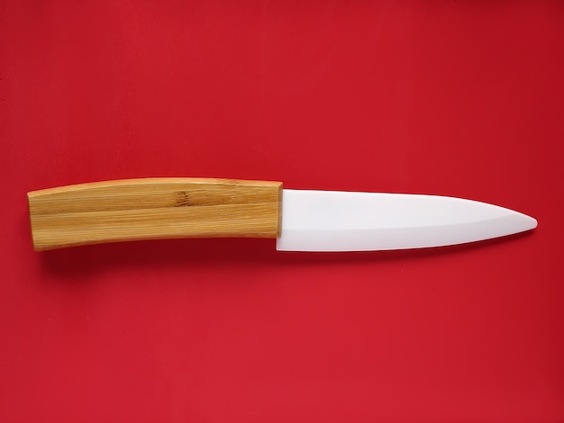 Kitchen knife on a red background