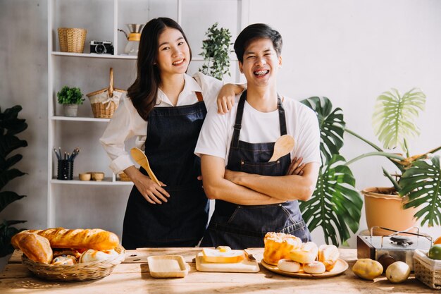 In Kitchen Perfectly Happy Couple Preparing Healthy Food Lots of Vegetables Man Juggles with Fruits Makes Her Girlfriend Laugh Lovely People in Love Have Fun