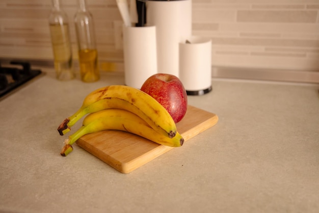 kitchen scene with bananas and mixed fruits
