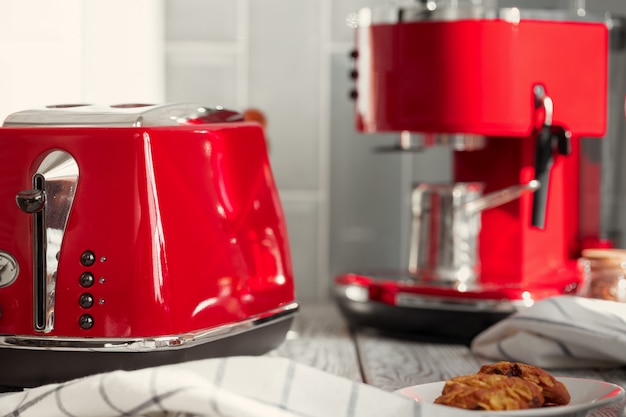 Kitchen shelf with red utensils and dishware