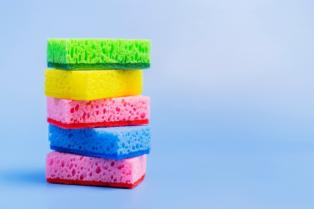 Photo kitchen sponges on a blue background.