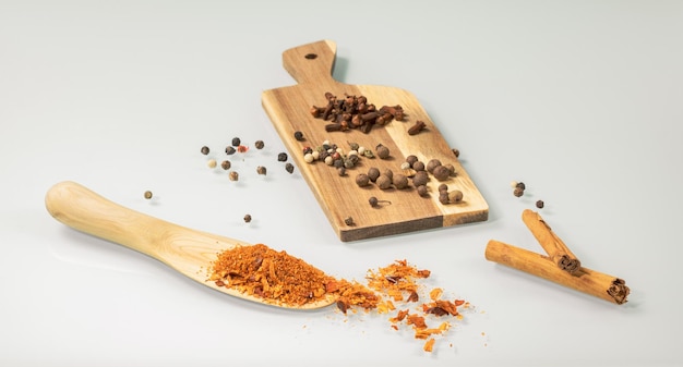 Kitchen still life Wooden spoon and mini board with various spices